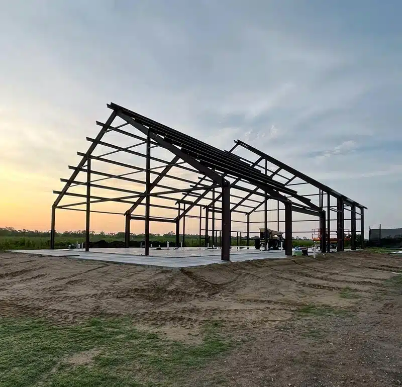 Barndominium frame at sunset in Kansas